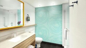 A modern bathroom with a large mirror, a sink, a toilet, and a shower. - TRU by Hilton Perrysburg Toledo, OH (Perrysburg)