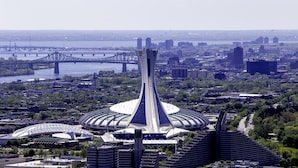 A modern architectural structure with a central tower and surrounding buildings, likely a hotel or conference center. - Hilton Garden Inn Montreal Midtown (Montreal)