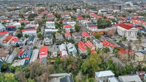 A densely packed urban area with a variety of building styles and red-roofed houses.