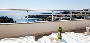 Outdoor dining - Four bedded studio with kitchen and private sea view balcony (UL)