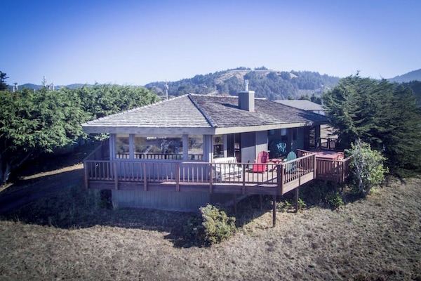 Shalimere has decking that surrounds most of the house Spa is steps from LR & MB