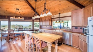 A spacious kitchen with wooden cabinets, a large island, and pendant lighting. - September and October dates are available!!! Are Panoramic Ocean Views for you ? (Manchester)