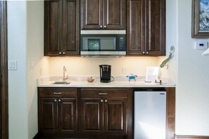 Fridge, microwave, coffee/tea maker, cookware/dishes/utensils