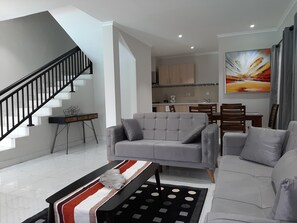 Superior Apartment | Living area | 29-inch LED TV with satellite channels, TV - Blue Ocean Apartments  Brufut (Brufut)