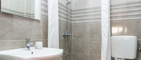 Shower, towels, toilet paper