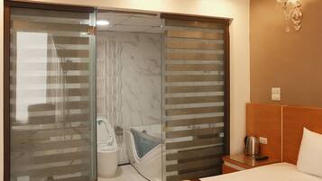 Deluxe Double Room, Beachfront | Bathroom | Shower, free toiletries, slippers, towels