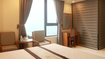 Deluxe Double Room, Beach View | Minibar, desk, free WiFi