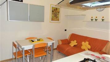 Apartment, 1 Bedroom (A50123) | Living area | 19-inch flat-screen TV with digital channels, TV