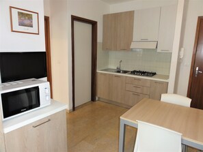 Apartment, 1 Bedroom (A50134) | Private kitchenette | Full-size fridge, stovetop, cookware/dishes/utensils - Condominio Franco (San Michele al Tagliamento)