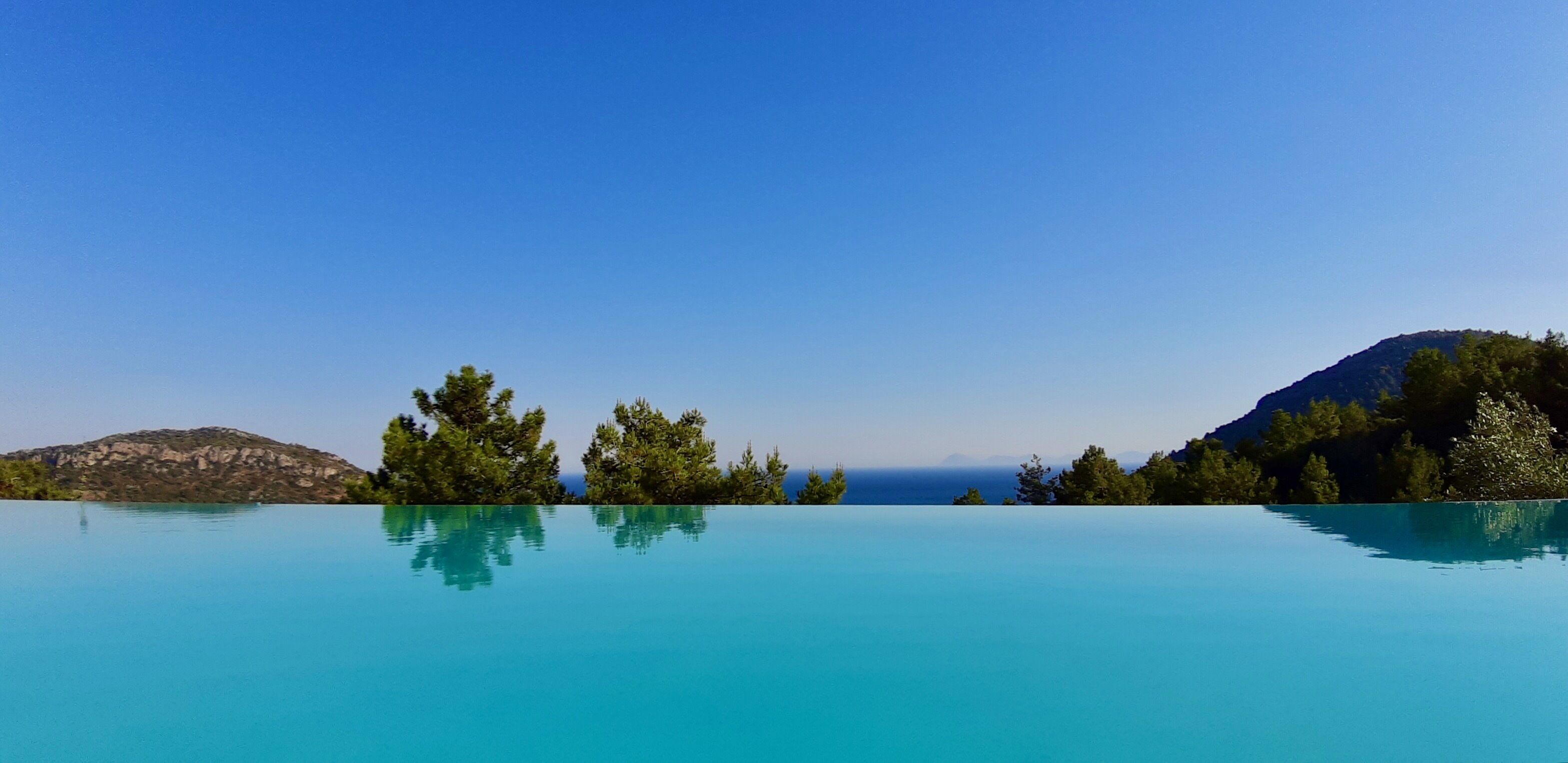 Seasonal outdoor pool, open 8:30 AM to 10:00 PM, pool umbrellas