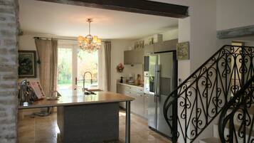 Villa | Private kitchen | Fridge, high chair