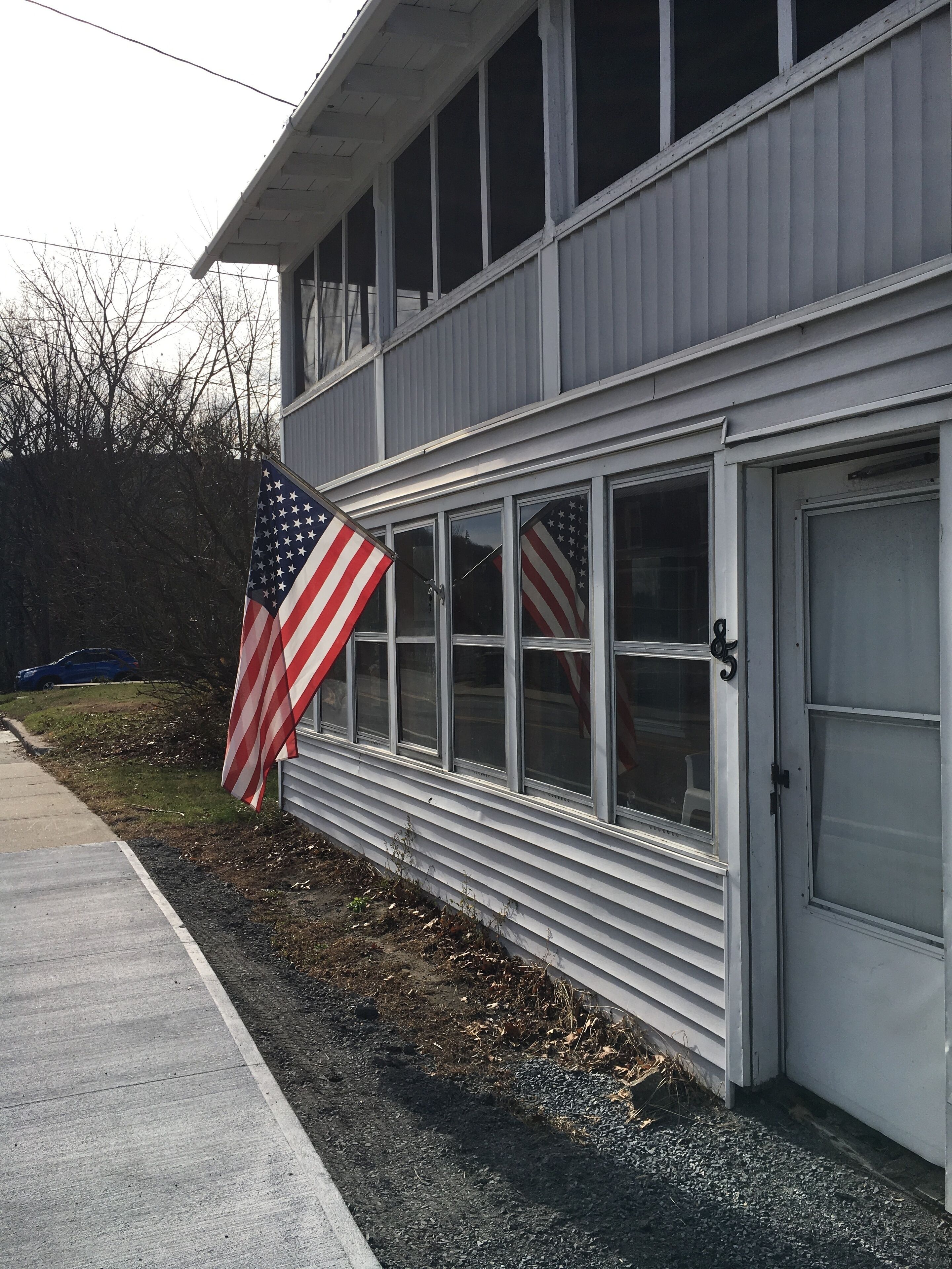 A building with a garage door and windows.