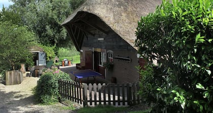 Quaint Farmhouse near River in Oosterwijk
