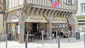 A traditional European brasserie with outdoor seating, a signboard, and a partially visible menu. - Beautiful Farmhouse With Private Pool (Perchede)