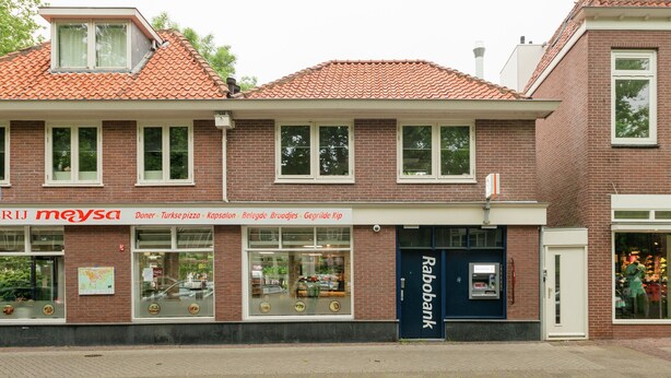 A building with a storefront labeled "RIJ meyza" and a "Rabobank" bank on the ground floor. - Elegant Apartment in Hoorn With Roof Terrace (Hoorn)