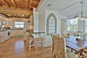 Enjoy cooking in this well-equipped kitchen with a large island and dining area.