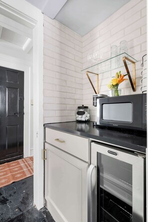 Fridge, microwave, coffee/tea maker, toaster