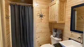 Combined shower/tub, hair dryer, towels, toilet paper