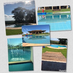 A swimming pool with a view of a building and trees. - Sítio Refúgio do Alto (Piracicaba)