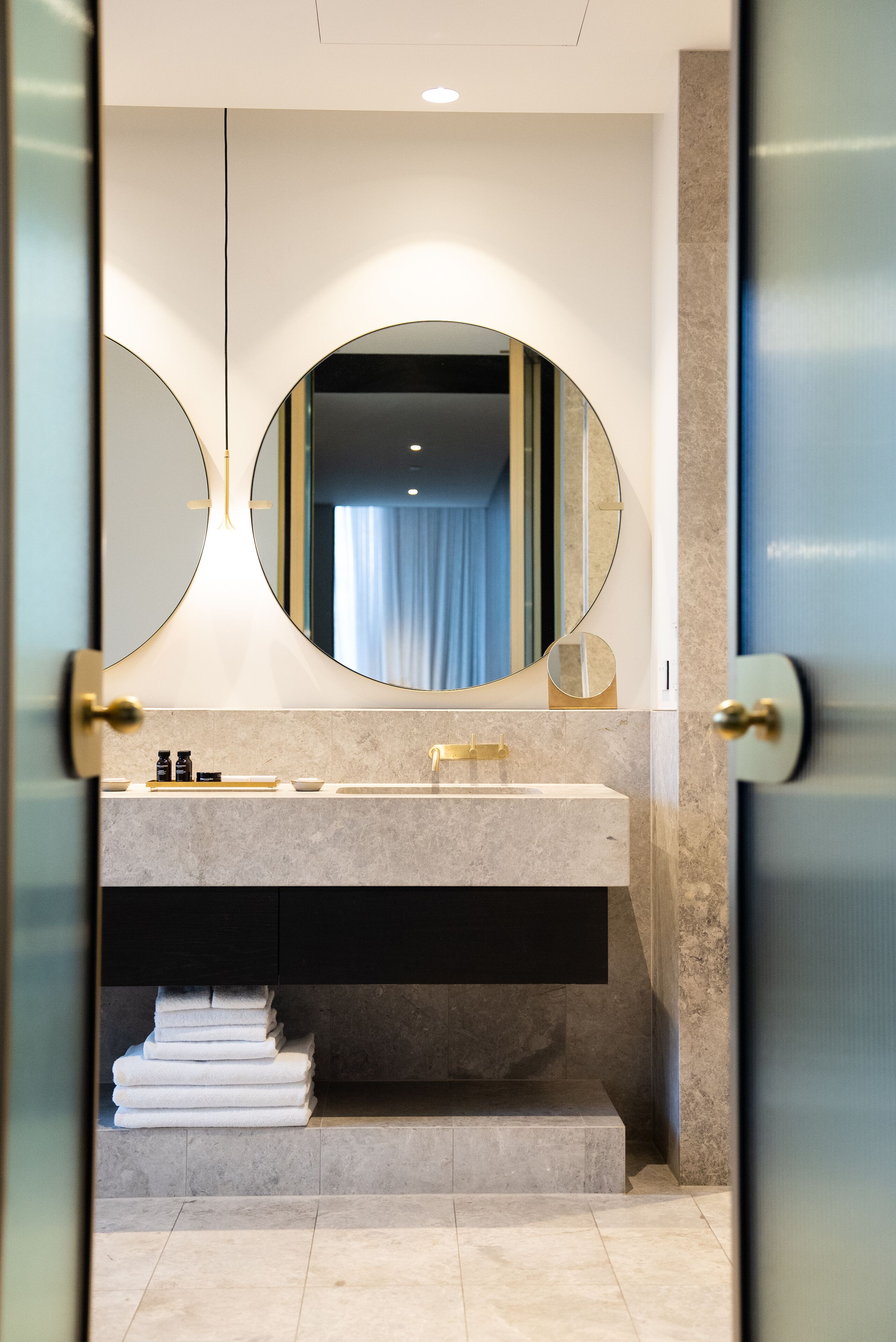 designer toiletries, hair dryer, bathrobes, slippers