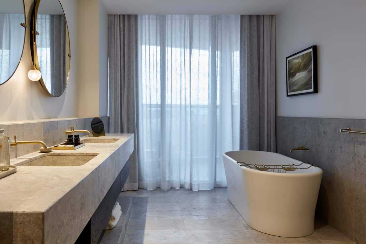 designer toiletries, hair dryer, bathrobes, slippers