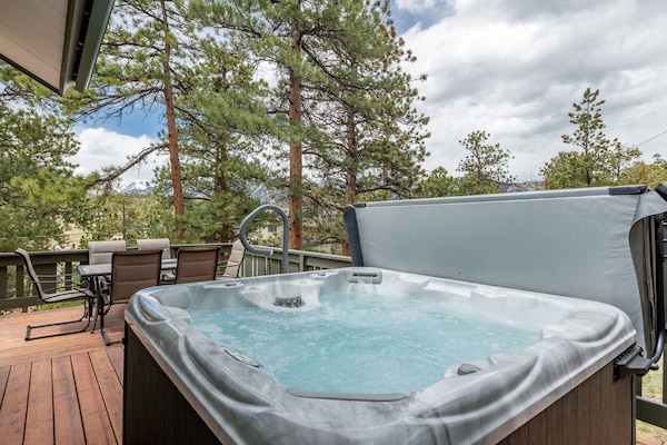 Relax in the spacious hot tub, enjoy views, BBQ and wildlife on the patio.