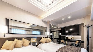 A hotel room with two beds, a large flat-screen TV, a desk, and a mirror. - APA HOTEL Roppongi Six (Tokyo)