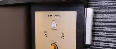 A control panel with room and desk lighting options, a power switch, and a night mode switch.