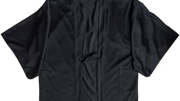 A black garment with a collar, long sleeves, and two chest pockets.