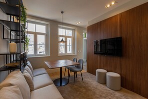 Signature appartement | Woonruimte | Een flatscreentelevisie