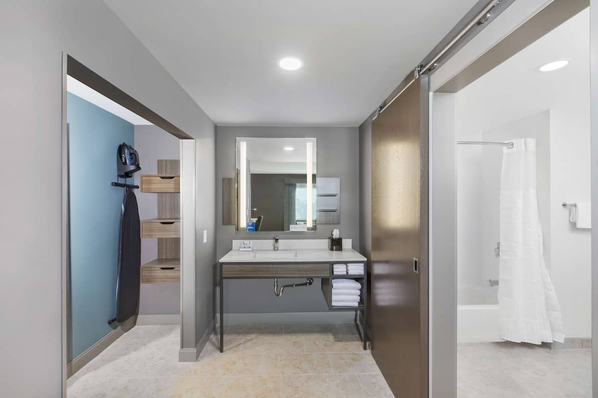 junior suite, 1 king bed | bathroom | hair dryer, towels