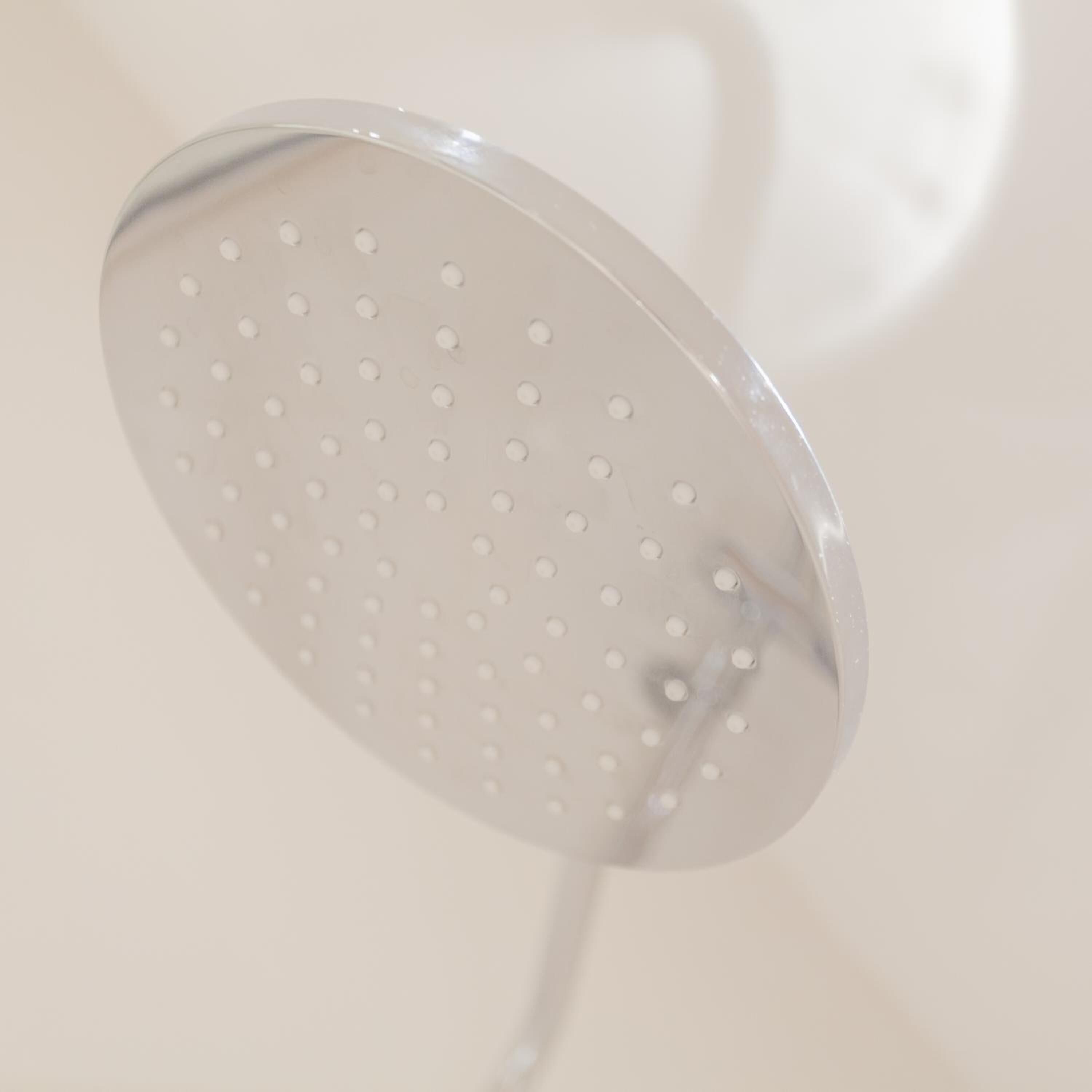 A showerhead with multiple round holes.
