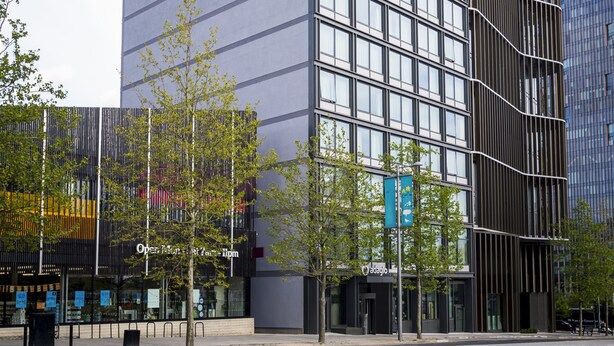 A modern building with a grid of windows, a curved facade, and a sign for 'Open Market St. & 5th'. - Aparthotel Adagio London Stratford (London)