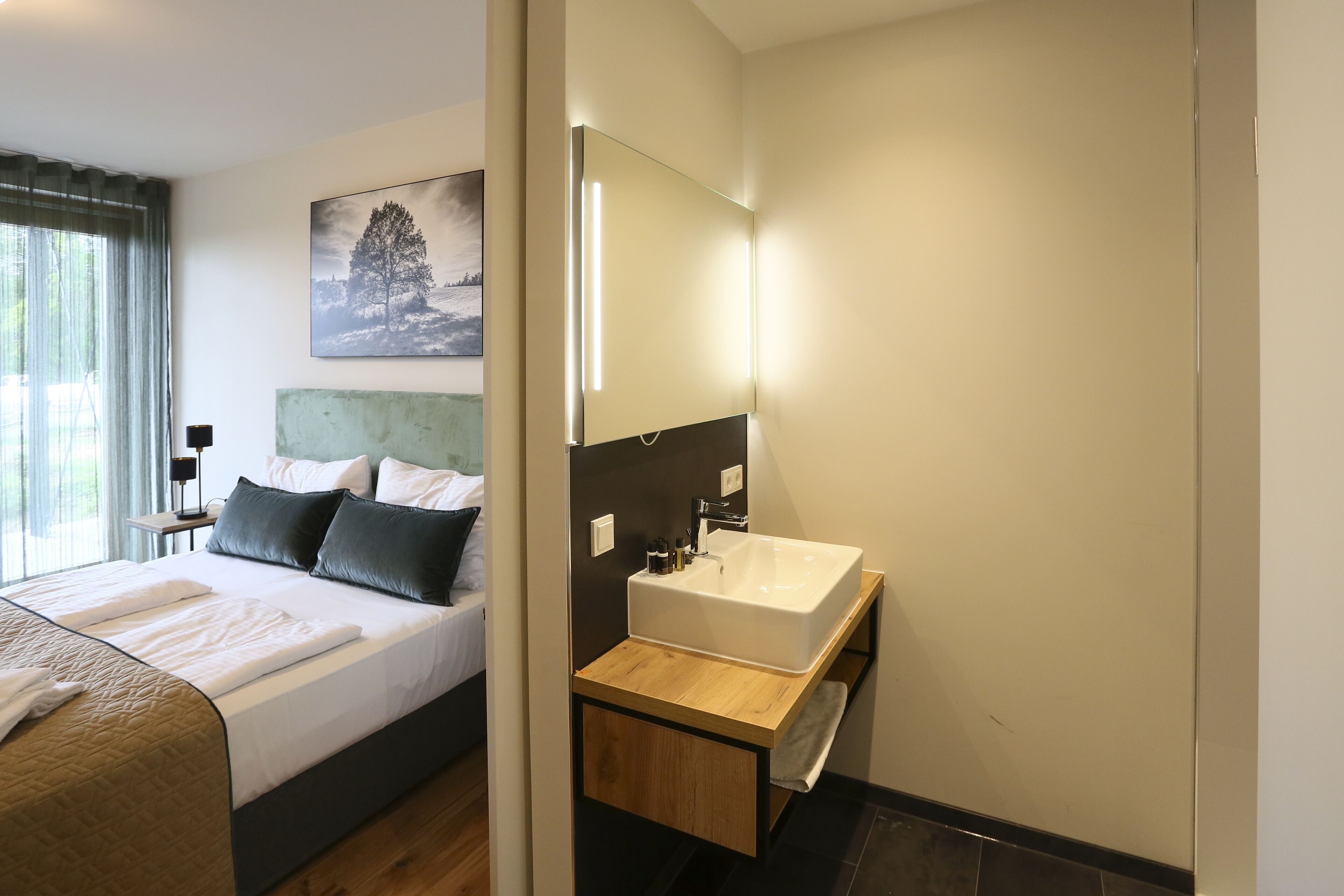 superior double room | bathroom | shower, rainfall showerhead, hair dryer, towels