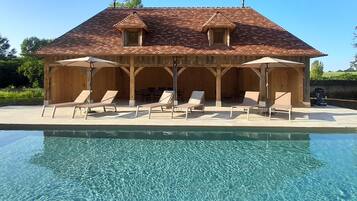 Seasonal outdoor pool, pool umbrellas, pool loungers