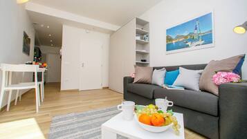 Estúdio família (Nido sui Tetti di Riva del Garda) | Área de estar | TV de tela plana