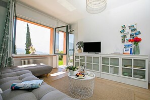 Family Apartment, Multiple Bedrooms, Mountainside (Casa Turchese) | Living area | Flat-screen TV