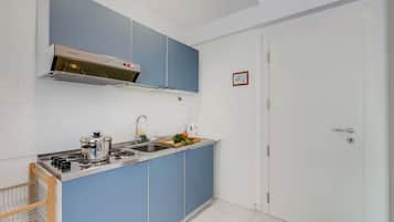 Family Apartment, Multiple Bedrooms, Lakeside (Residenza Lago D'Argento) | Private kitchen | Fridge, microwave, stovetop, coffee/tea maker