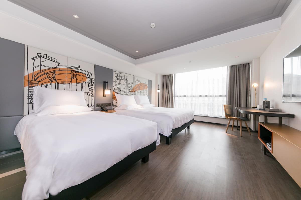 Premium bedding, down duvets, memory-foam beds, desk