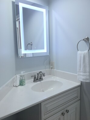 Combined shower/bathtub, hair dryer, towels, soap