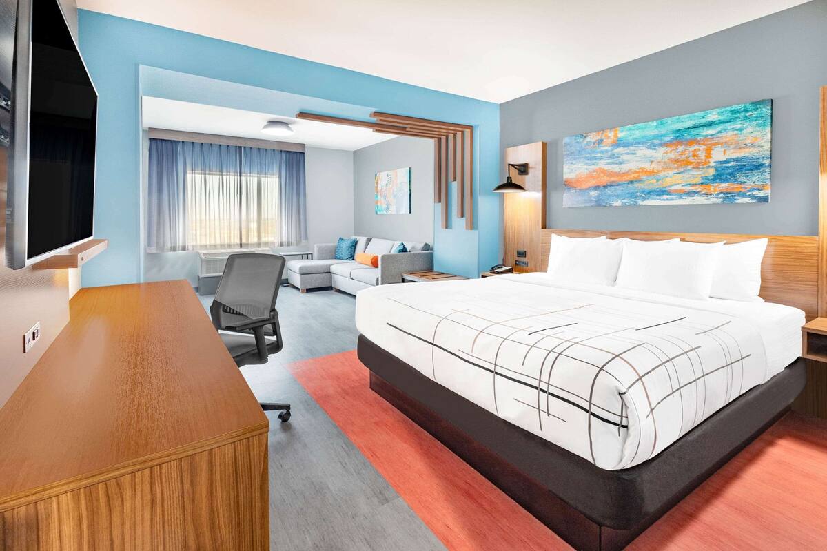 suite, 1 king bed, non smoking | desk, laptop workspace, iron/ironing board, free wifi