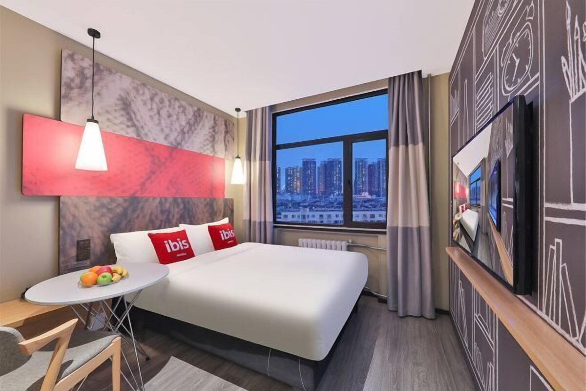 Premium bedding, desk, laptop workspace, blackout curtains