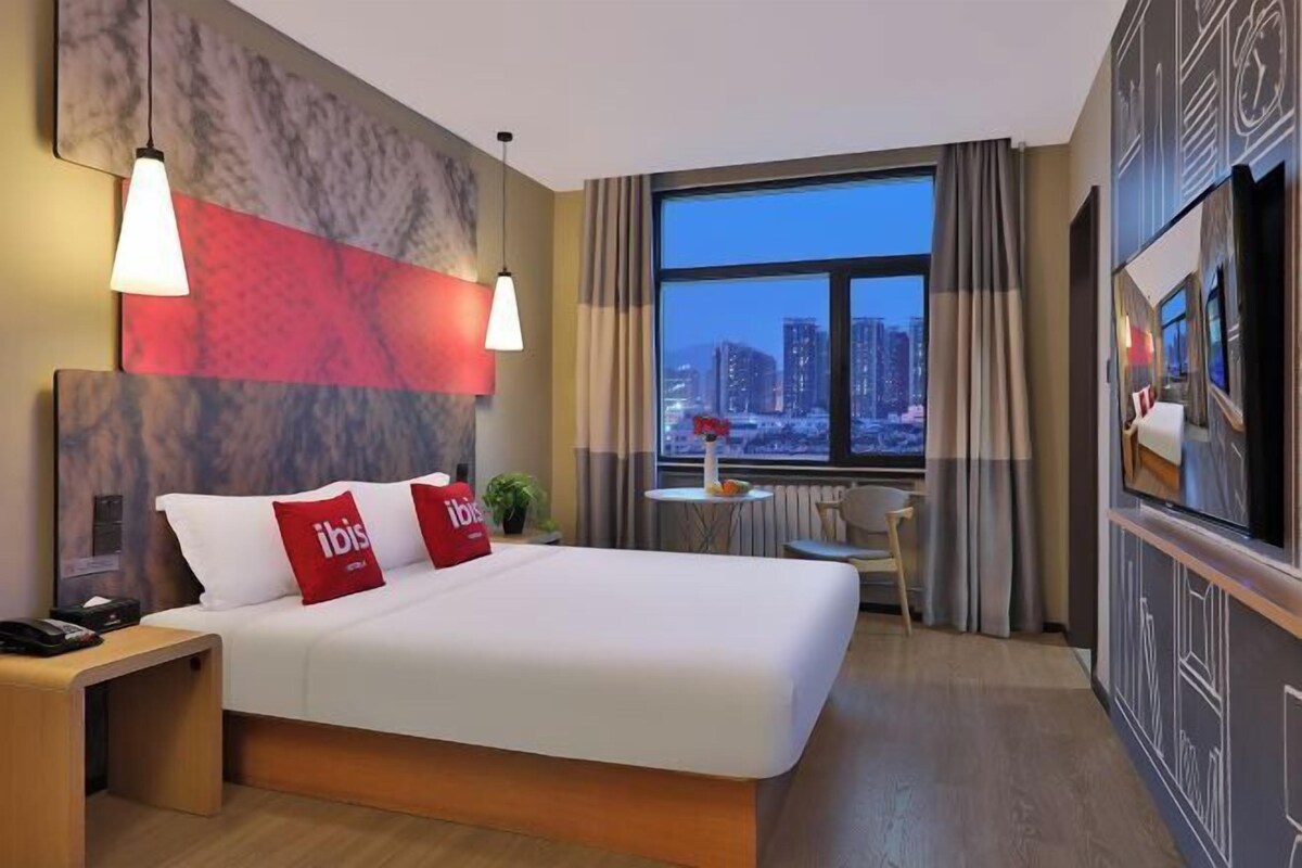 Premium bedding, desk, laptop workspace, blackout curtains