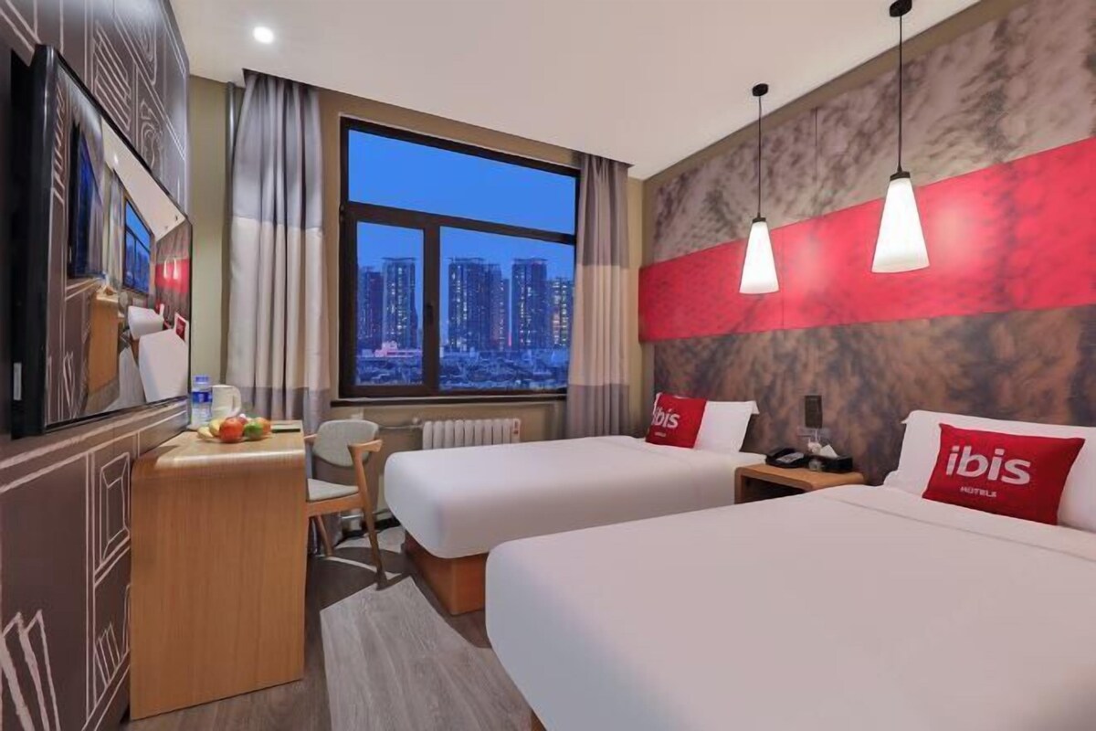 Premium bedding, desk, laptop workspace, blackout curtains