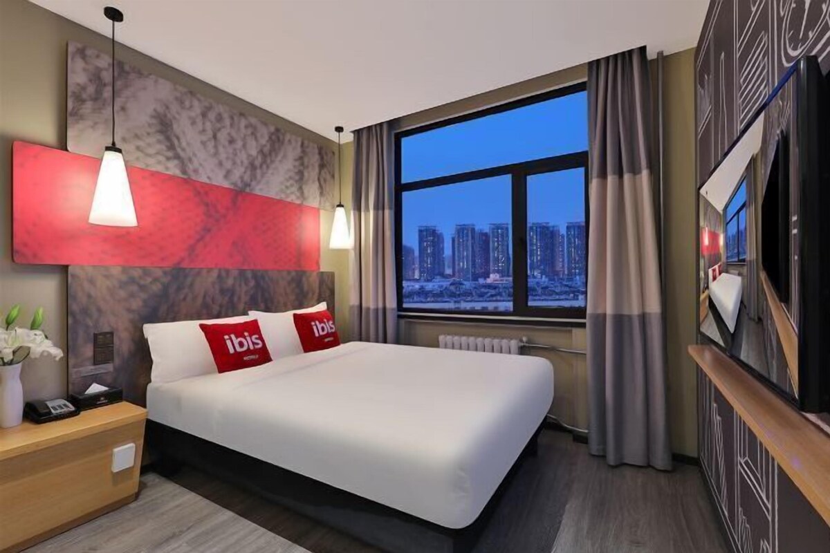Premium bedding, desk, laptop workspace, blackout curtains