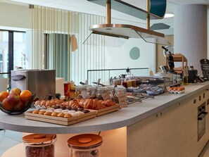 A breakfast buffet with various food items and a coffee station. - Aparthotel Adagio Access Brussels Delta (Brussels)