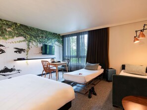 Premium bedding, laptop workspace, blackout drapes, soundproofing