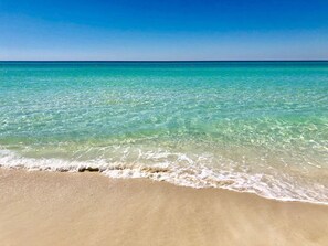 A beach with clear turquoise water and a sandy shore. - 208 Celadon Beach Free Beach Service for FOUR!  2BR/2BA and Custom Bunk Room! (Panama City Beach)