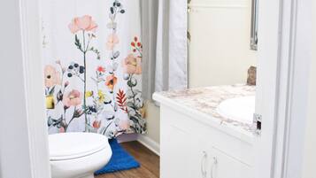 Combined shower/bathtub, hair dryer, towels, soap
