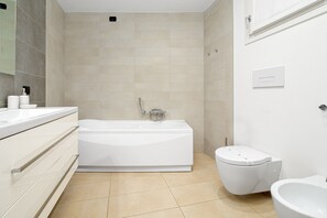 Bathtub, hair dryer, towels